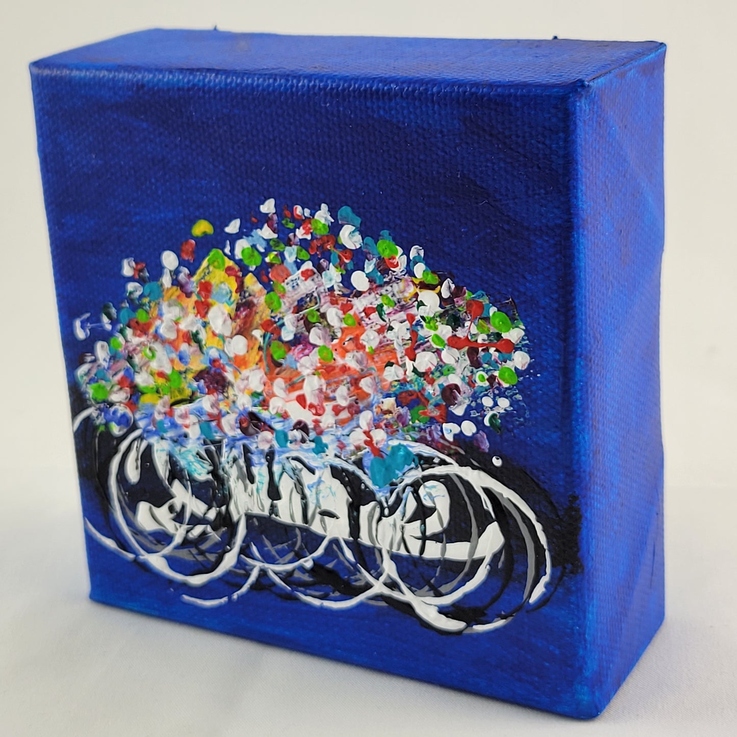 4x4 inch canvas painting with blue background and bold colors