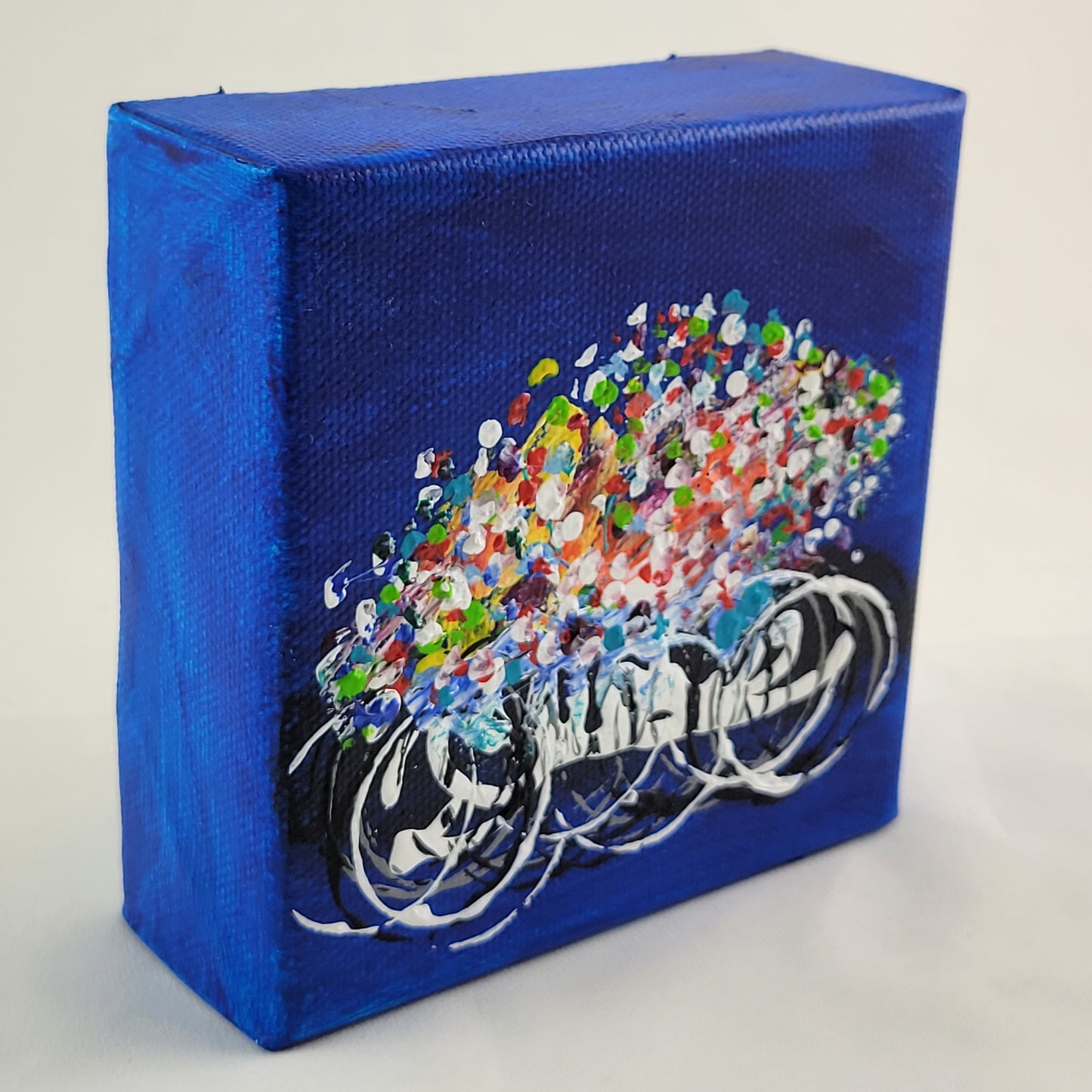 4x4 inch canvas painting with blue background and bold colors