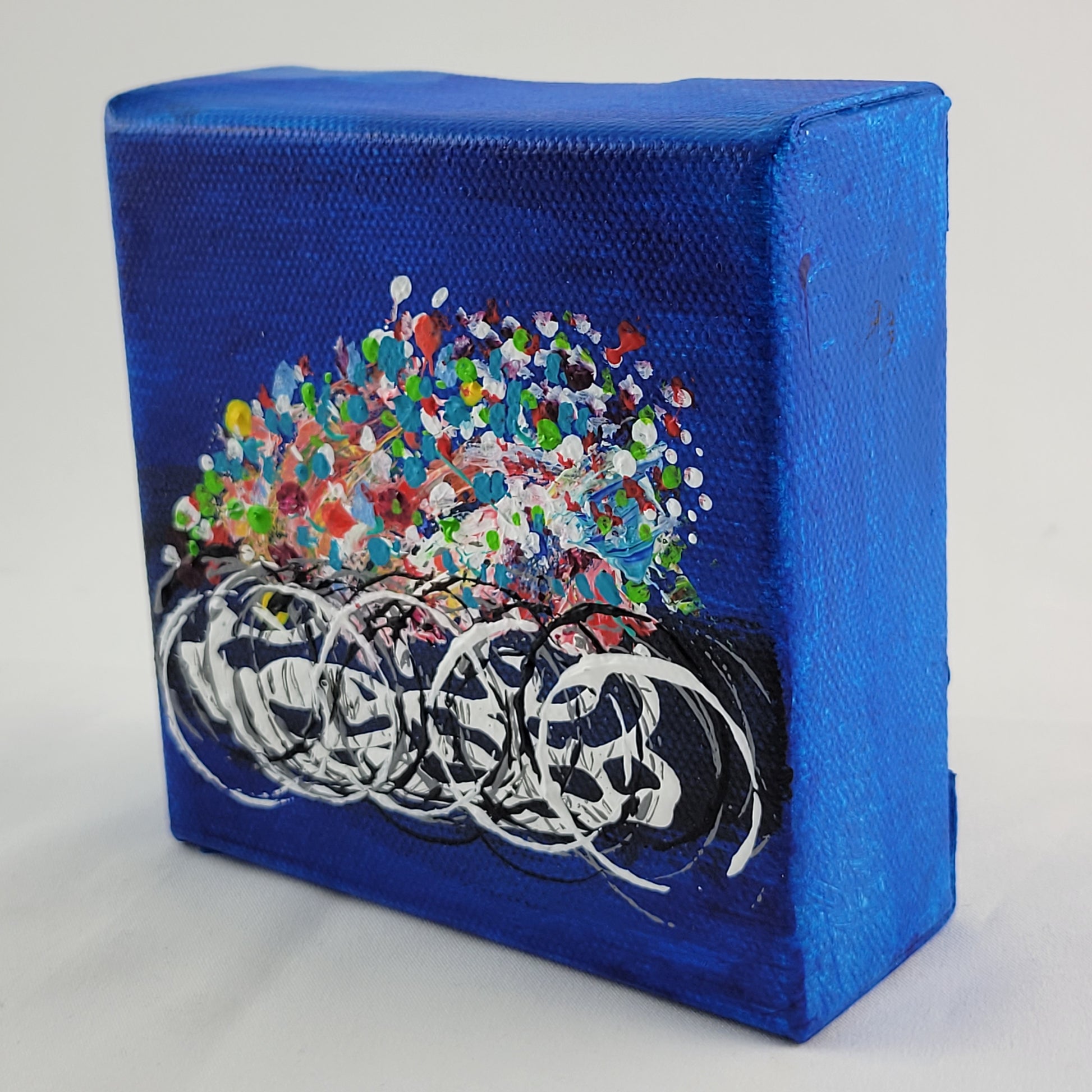 4x4 inch canvas painting with blue background and bold colors