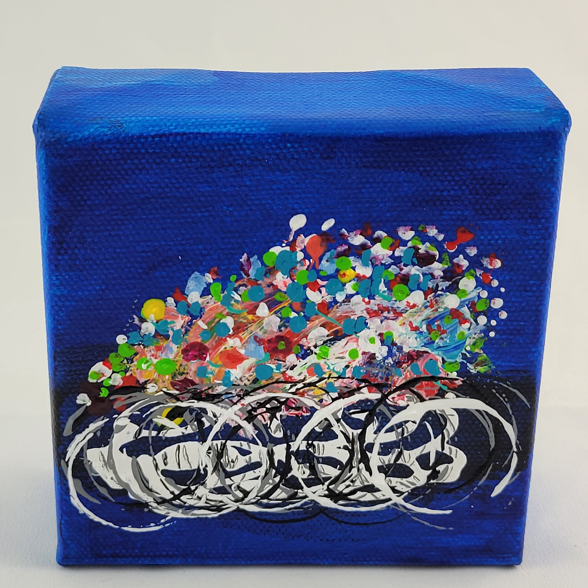 4x4 inch canvas painting with blue background and bold colors