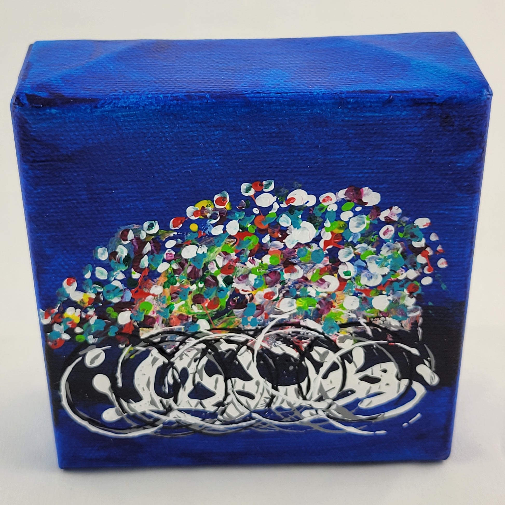 4x4 inch canvas painting with blue background and bold colors