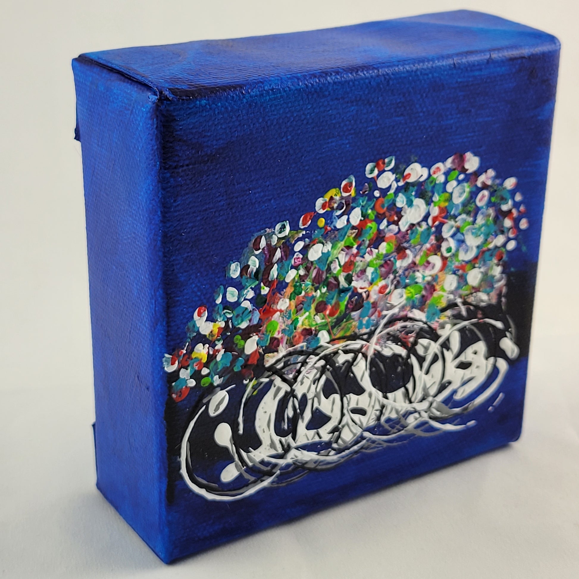 4x4 inch canvas painting with blue background and bold colors