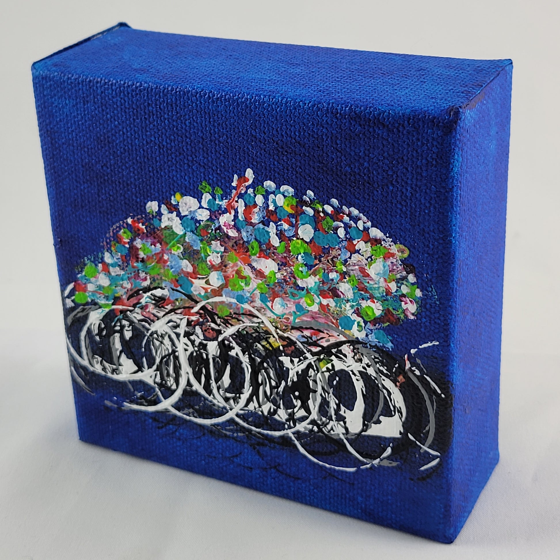 4x4 inch canvas painting with blue background and bold colors