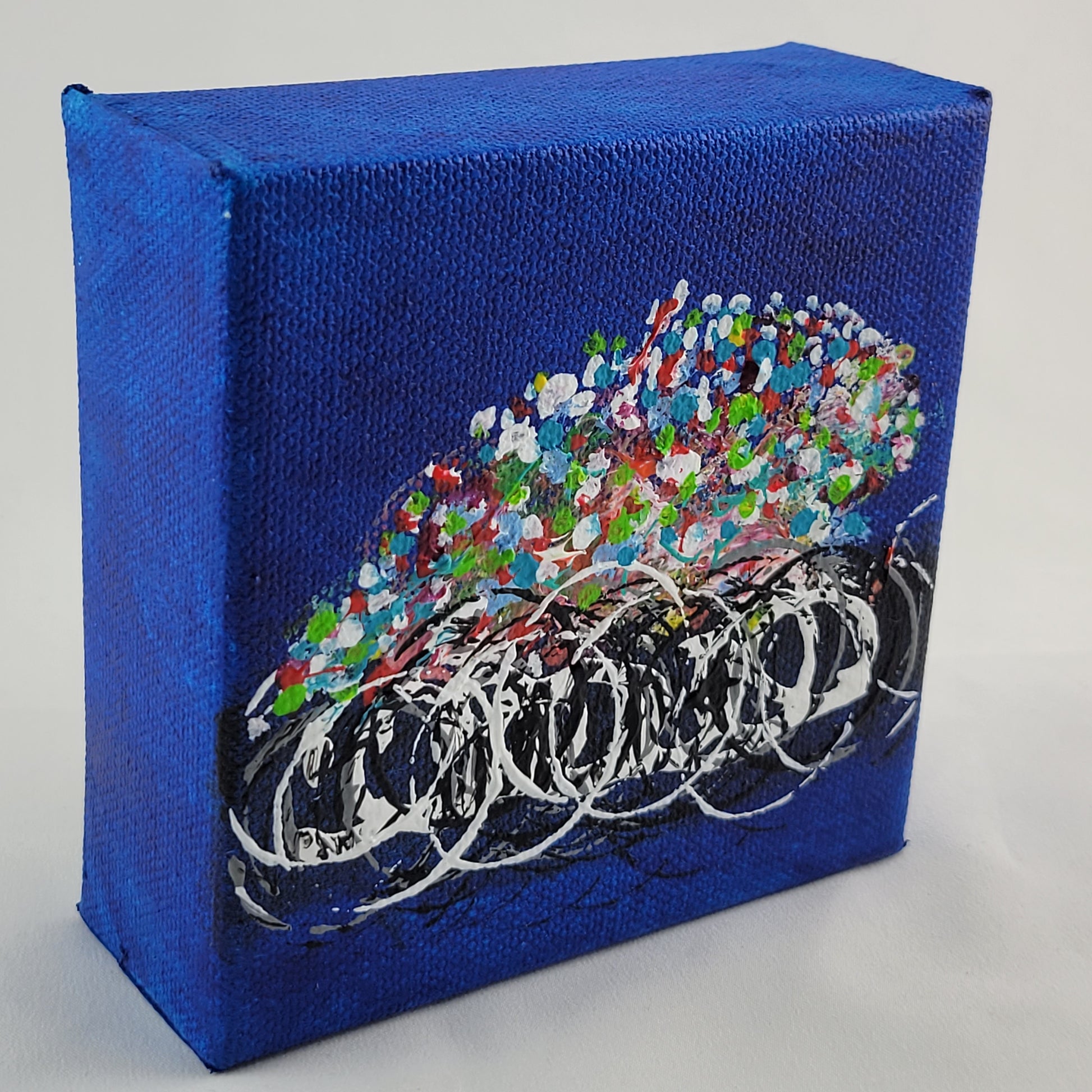 4x4 inch canvas painting with blue background and bold colors
