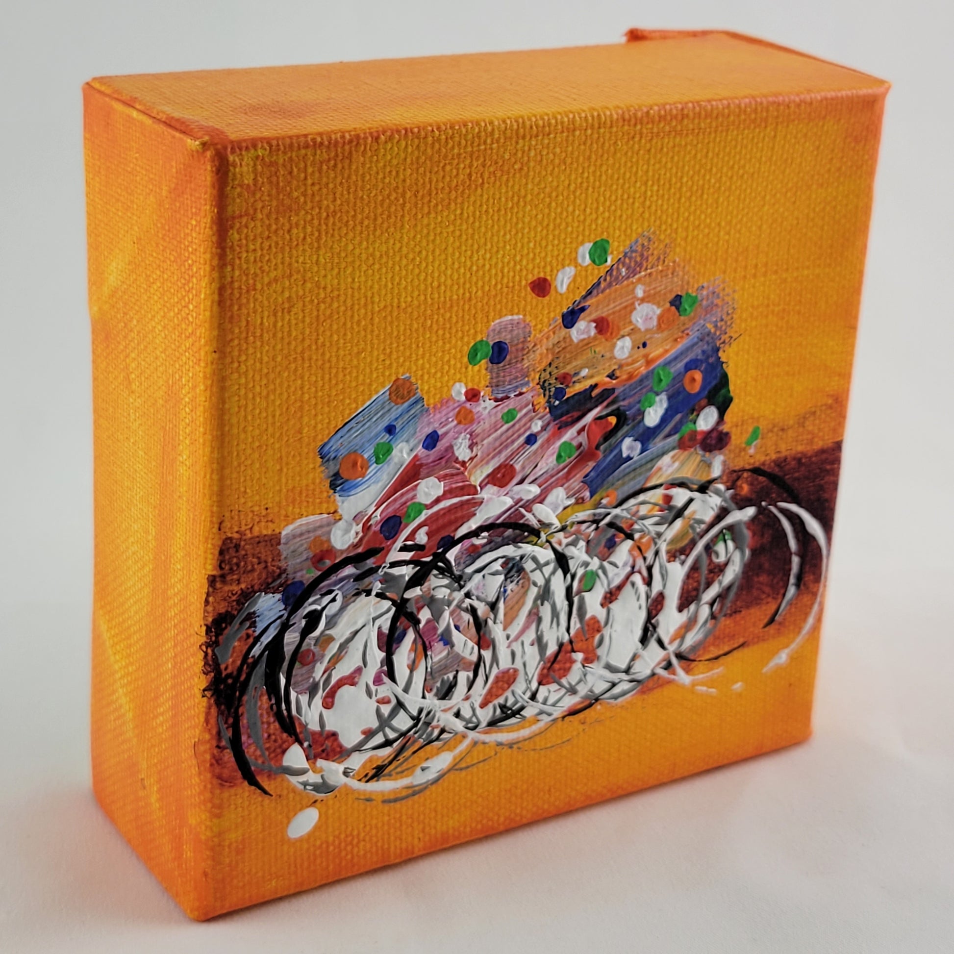 4x4 inch canvas painting with orange background and bold colors