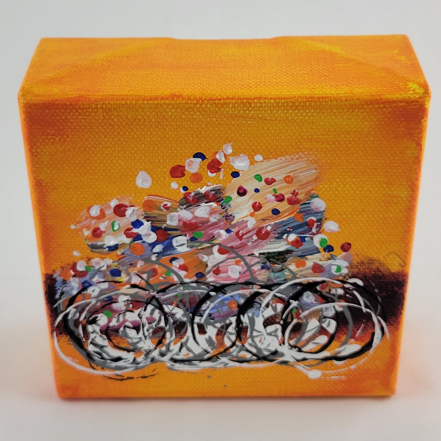 4x4 inch canvas painting with orange background and bold colors