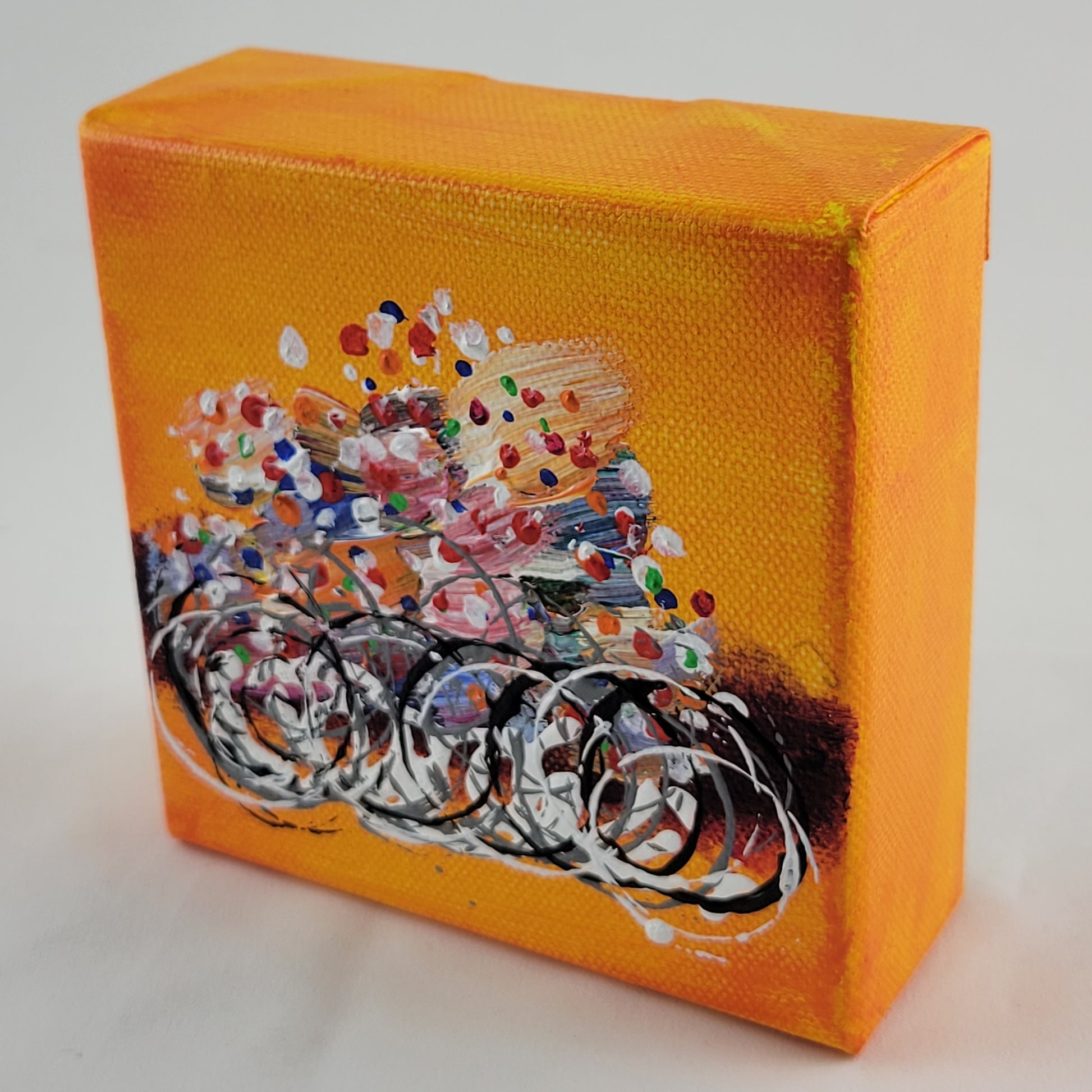 4x4 inch canvas painting with orange background and bold colors