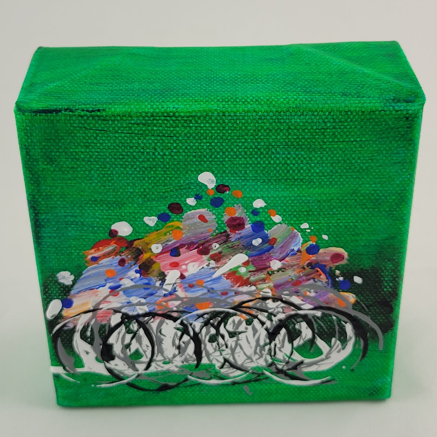 4x4 inch canvas painting with green background and bold colors