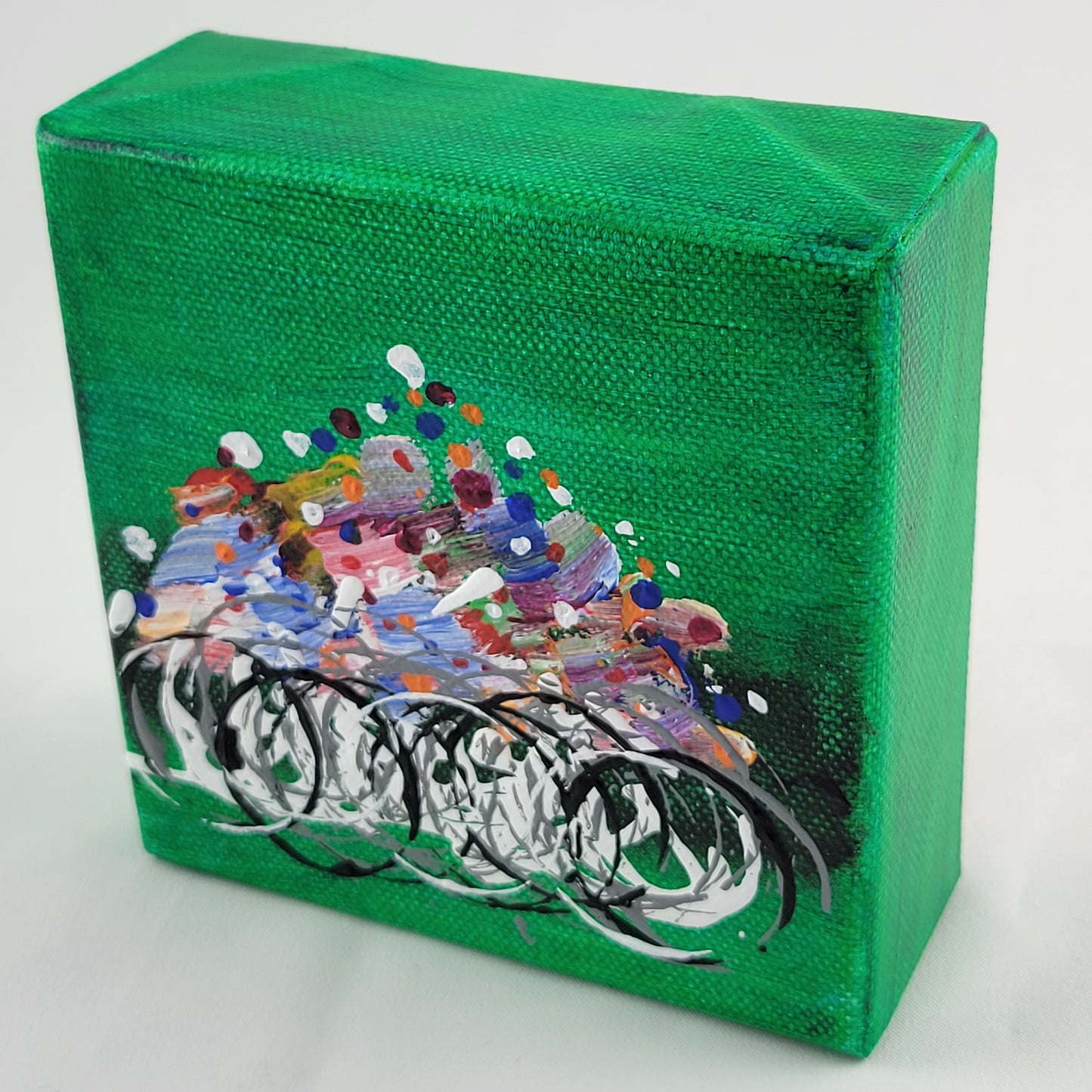 4x4 inch canvas painting with green background and bold colors