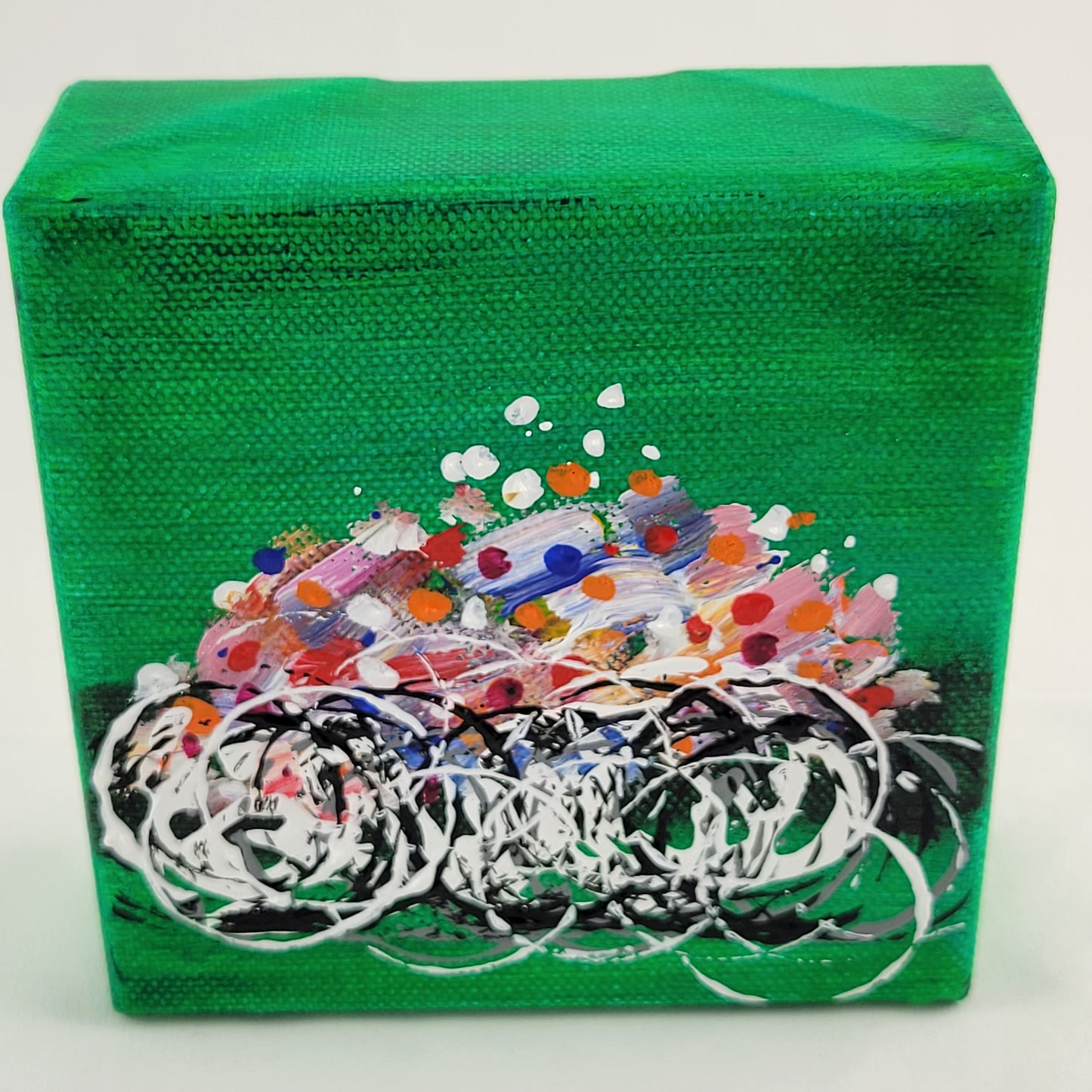 4x4 inch canvas painting with green background and bold colors