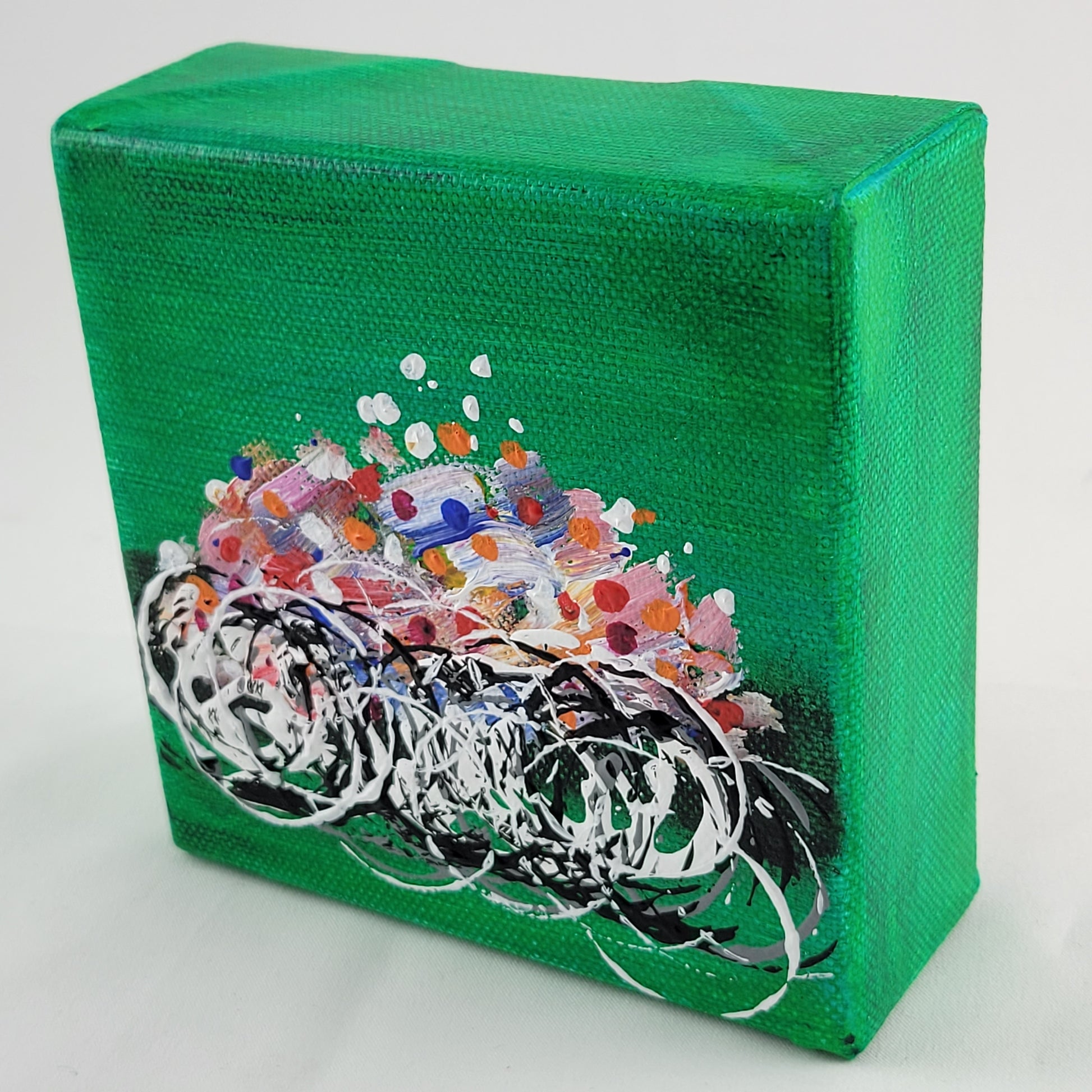 4x4 inch canvas painting with green background and bold colors