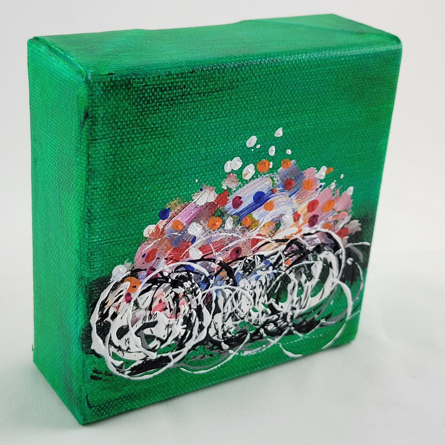 4x4 inch canvas painting with green background and bold colors