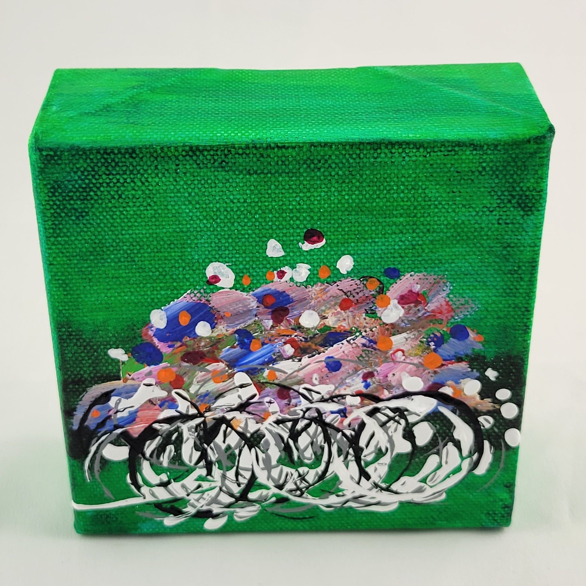 4x4 inch canvas painting with green background and bold colors