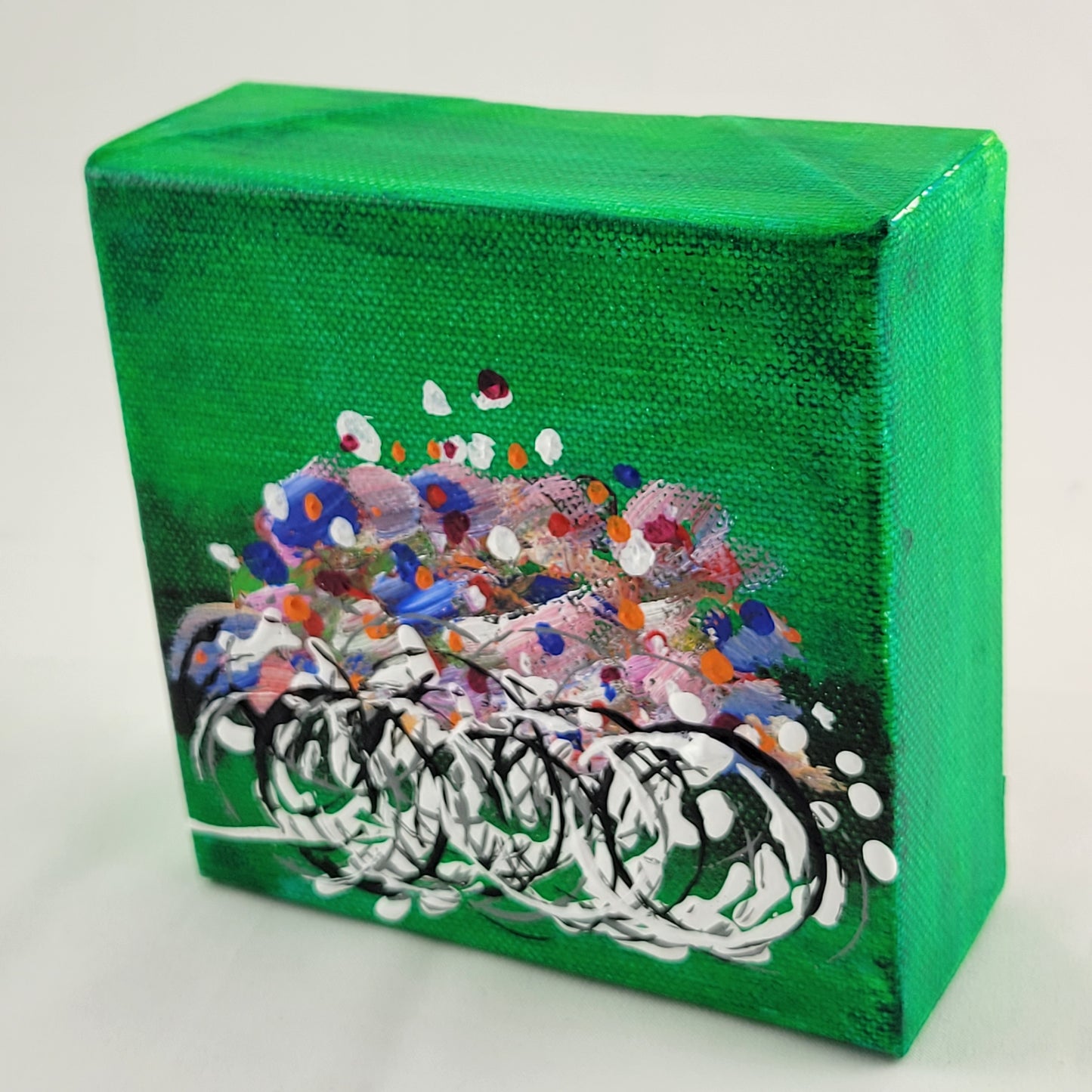 4x4 inch canvas painting with green background and bold colors