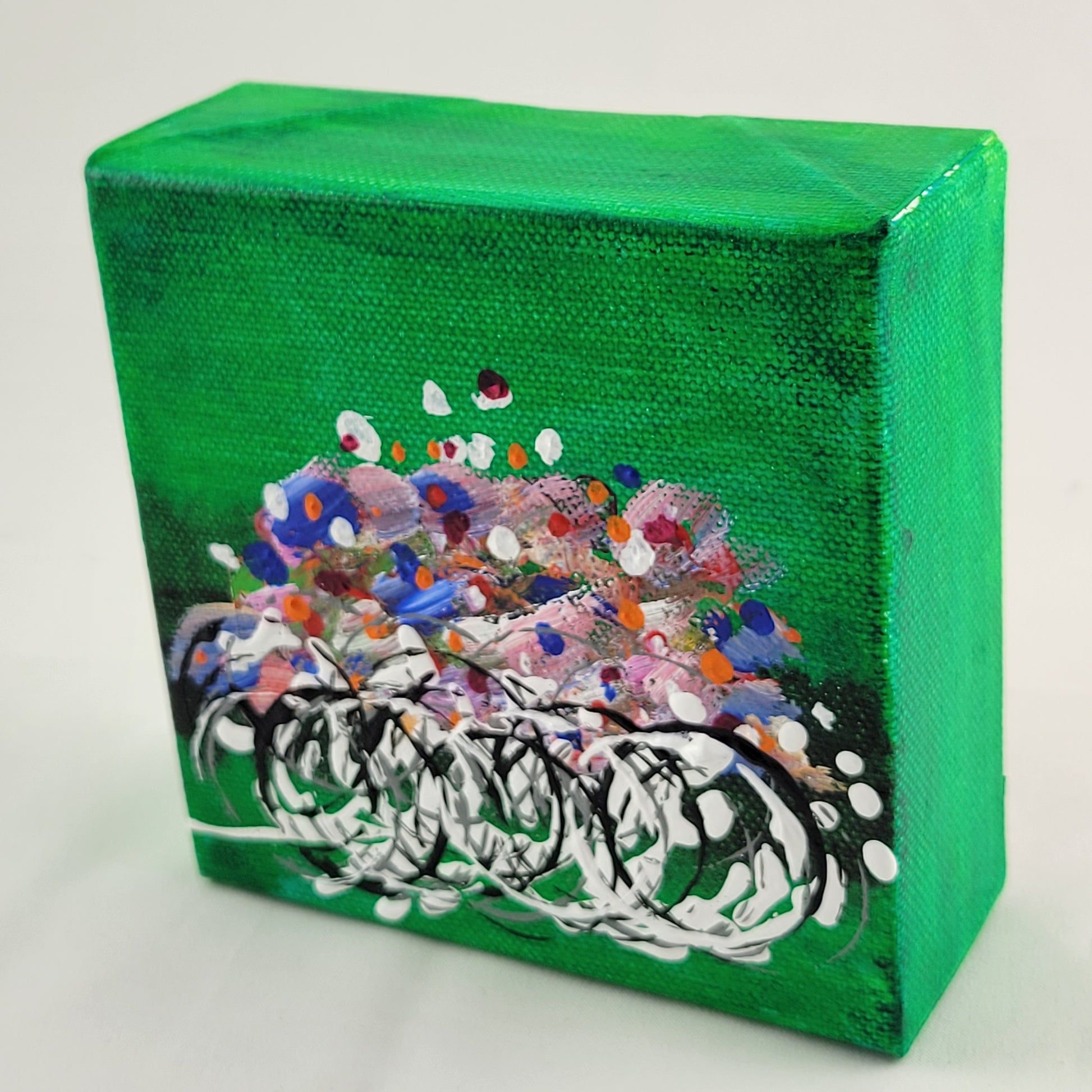 4x4 inch canvas painting with green background and bold colors