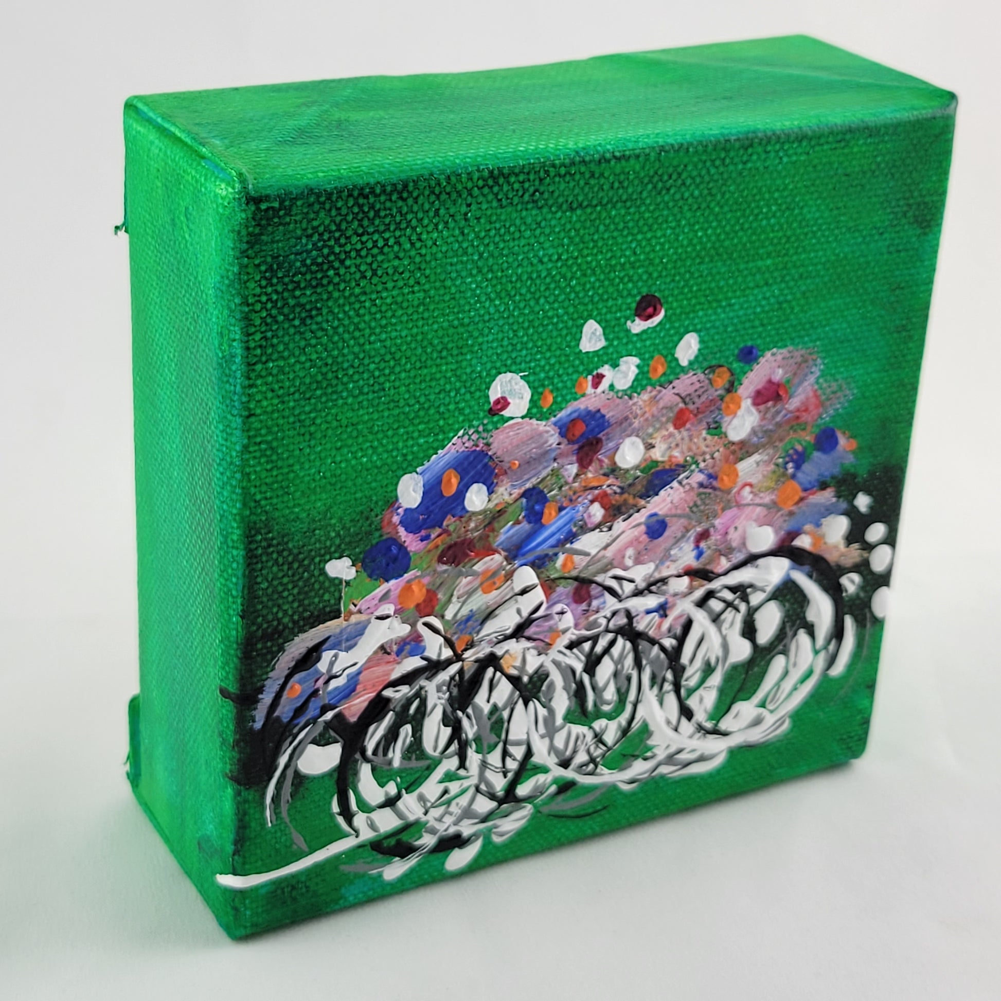 4x4 inch canvas painting with green background and bold colors