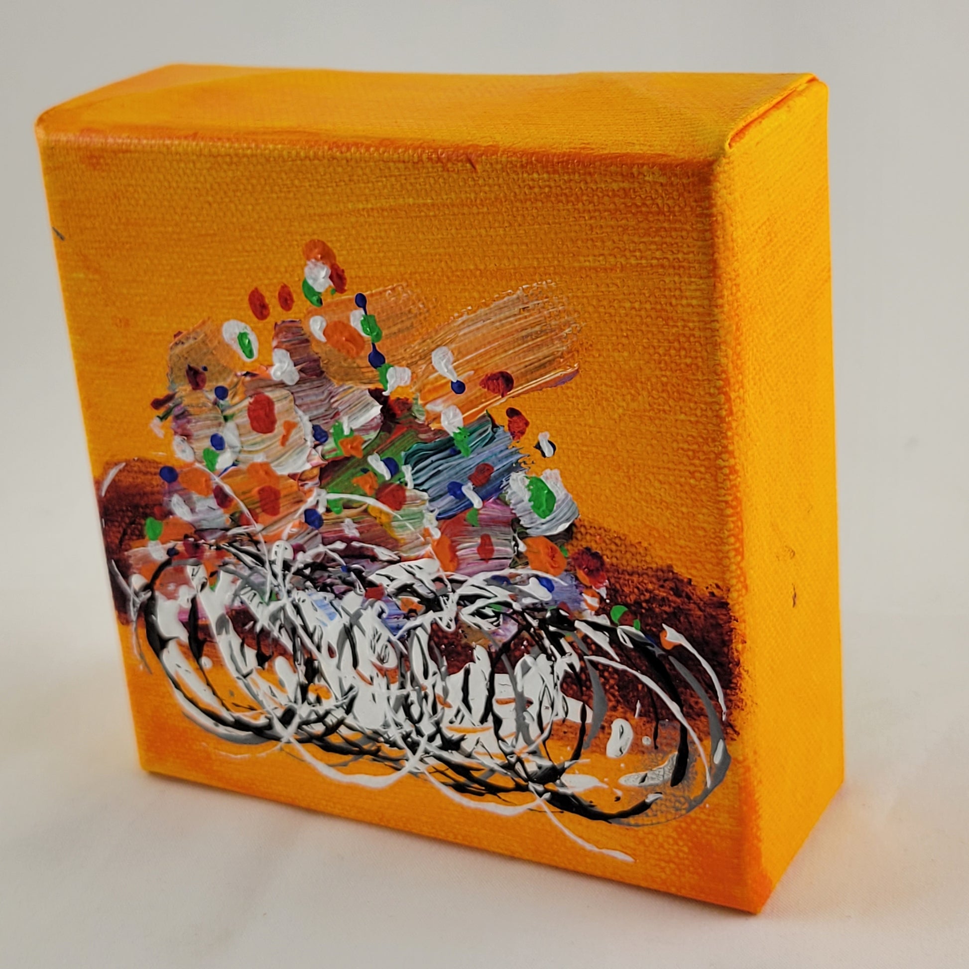 4x4 inch canvas painting with orange background and bold colors