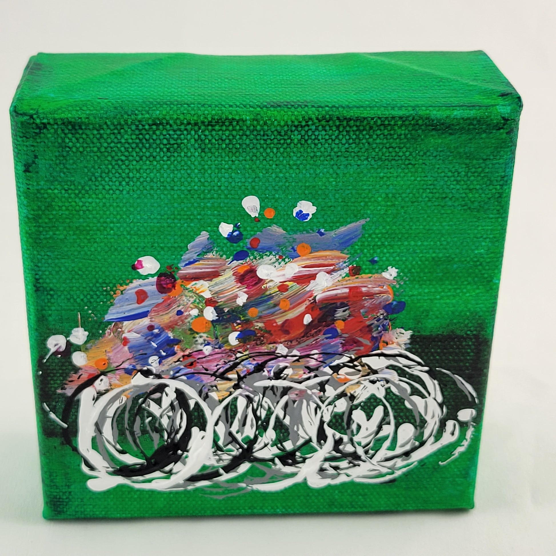 4x4 inch canvas painting with green background and bold colors